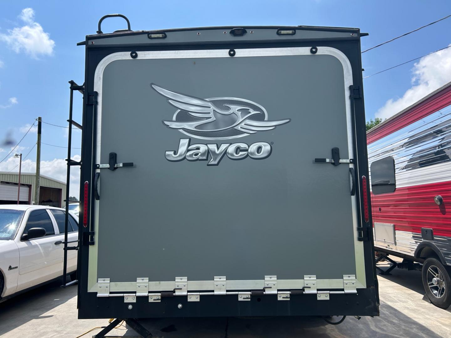 2018 Silver JAYCO OCTANE (1UJBJSBJXJ1) , located at 17760 Hwy 62, Morris, OK, 74445, 35.609104, -95.877060 - 2018 JAYCO OCTANE SUPER LITE 161 TOYHAULER IS 16FT, FEATURES STAINLESS STEEL APPLIANCES, SEAMLESS COUNTERTOPS, SPRING ASSIST REAR RAMP DOOR, SLIDE DOWN SCREEN DOOR, REAR ELECTRIC QUEEN BED WITH ROLLOVER SOFA, TUB/SHOWER COMBO, INTERIOR/EXTERIOR SPEAKERS, OUTSIDE SHOWER, AND AN OUTSIDE FILL UP STATIO - Photo#2